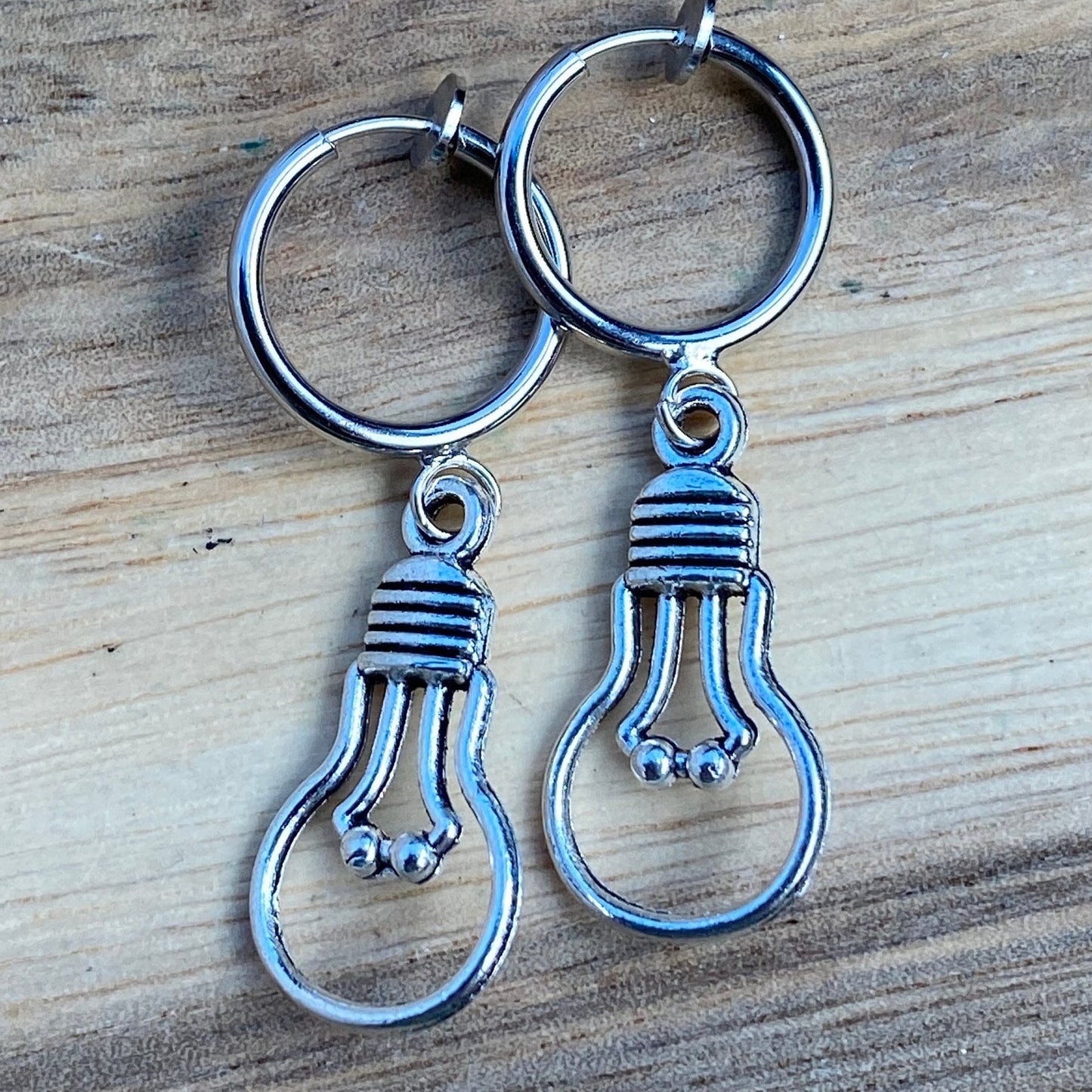 Adorable dangling lightbulb clip on earrings, cute bronze or silver earrings