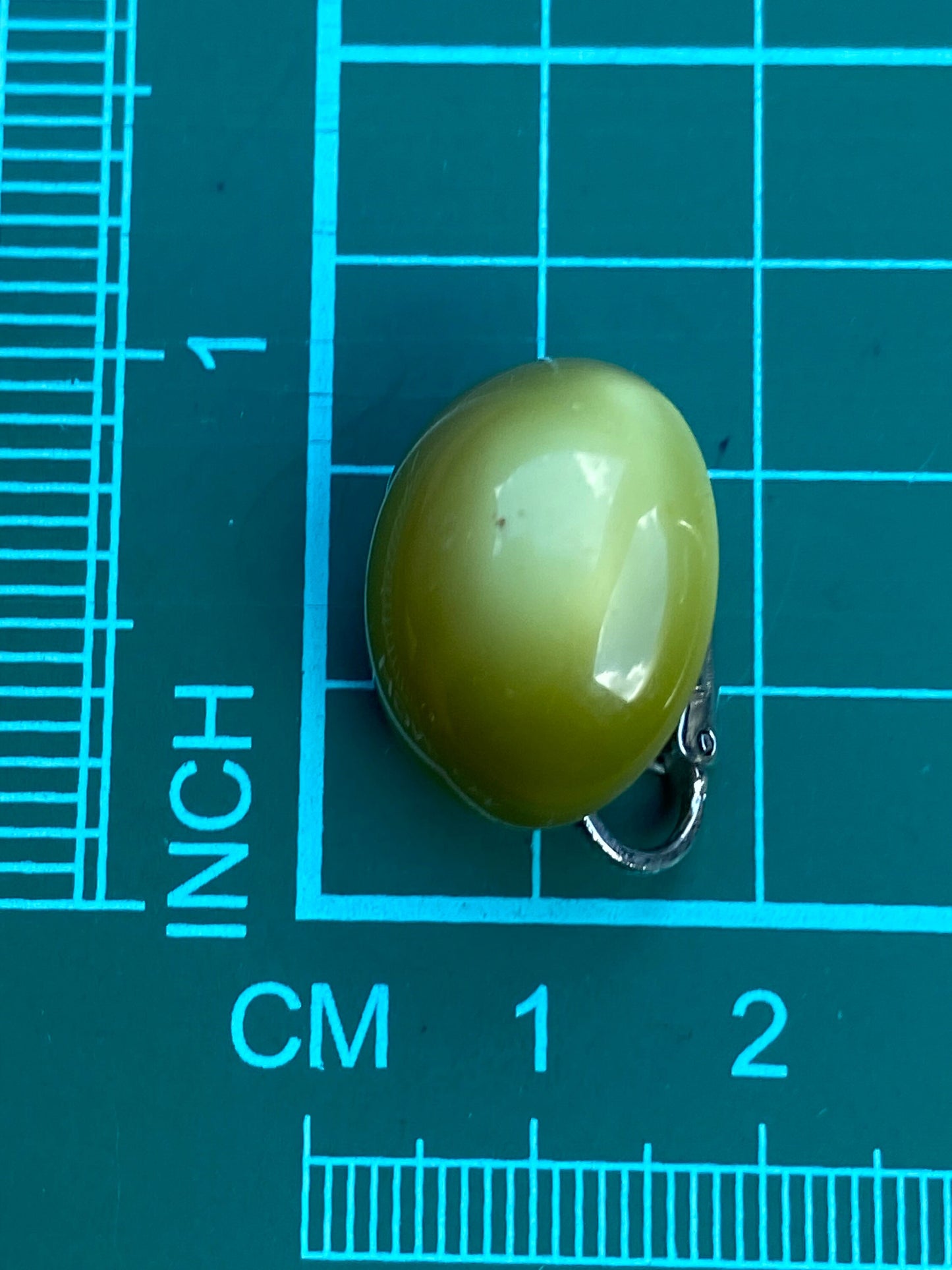 Vintage luminous olive green moonglow cabochon oval clip on earrings, Richelieu earrings