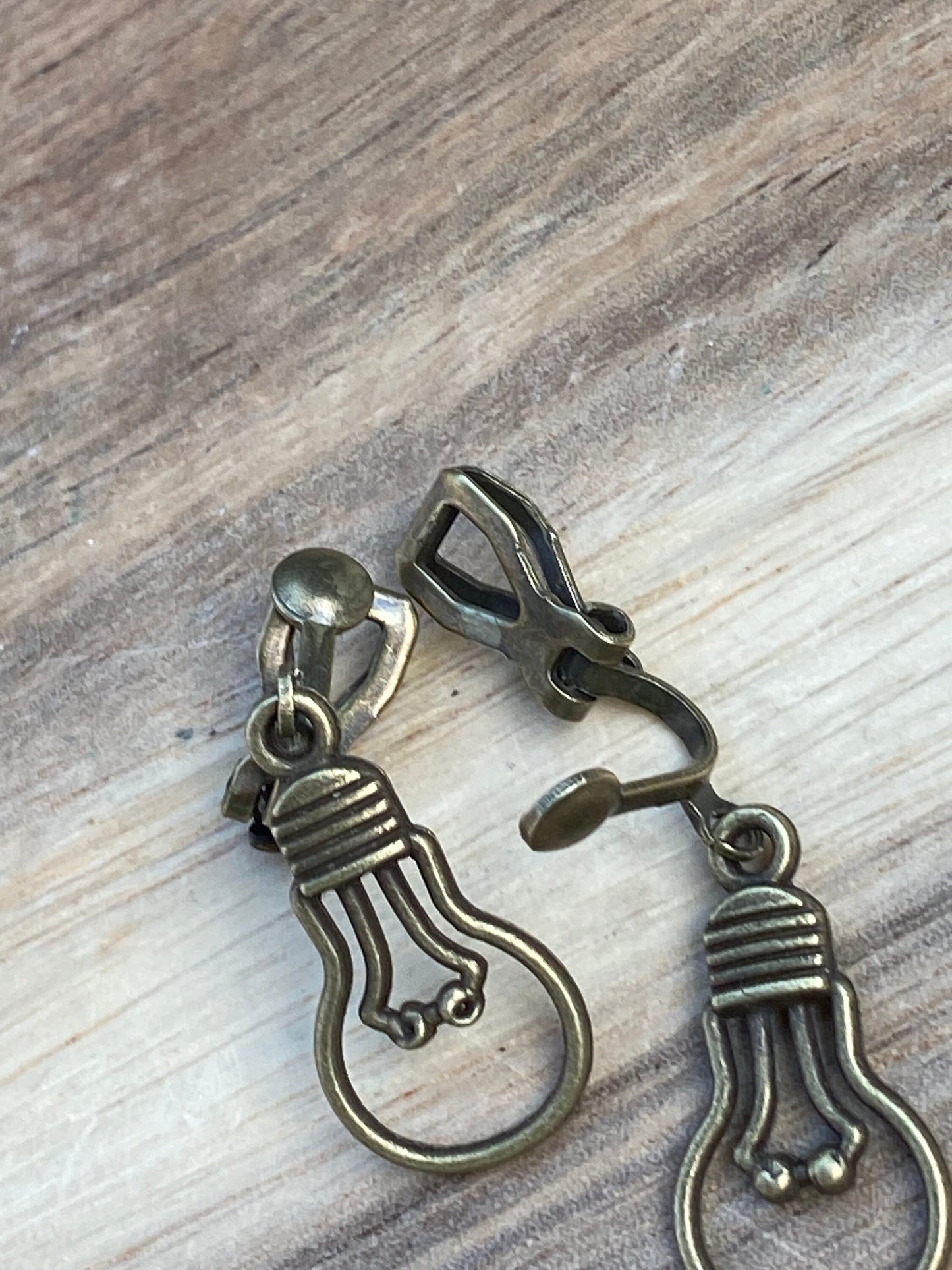 Adorable dangling lightbulb clip on earrings, cute bronze or silver earrings