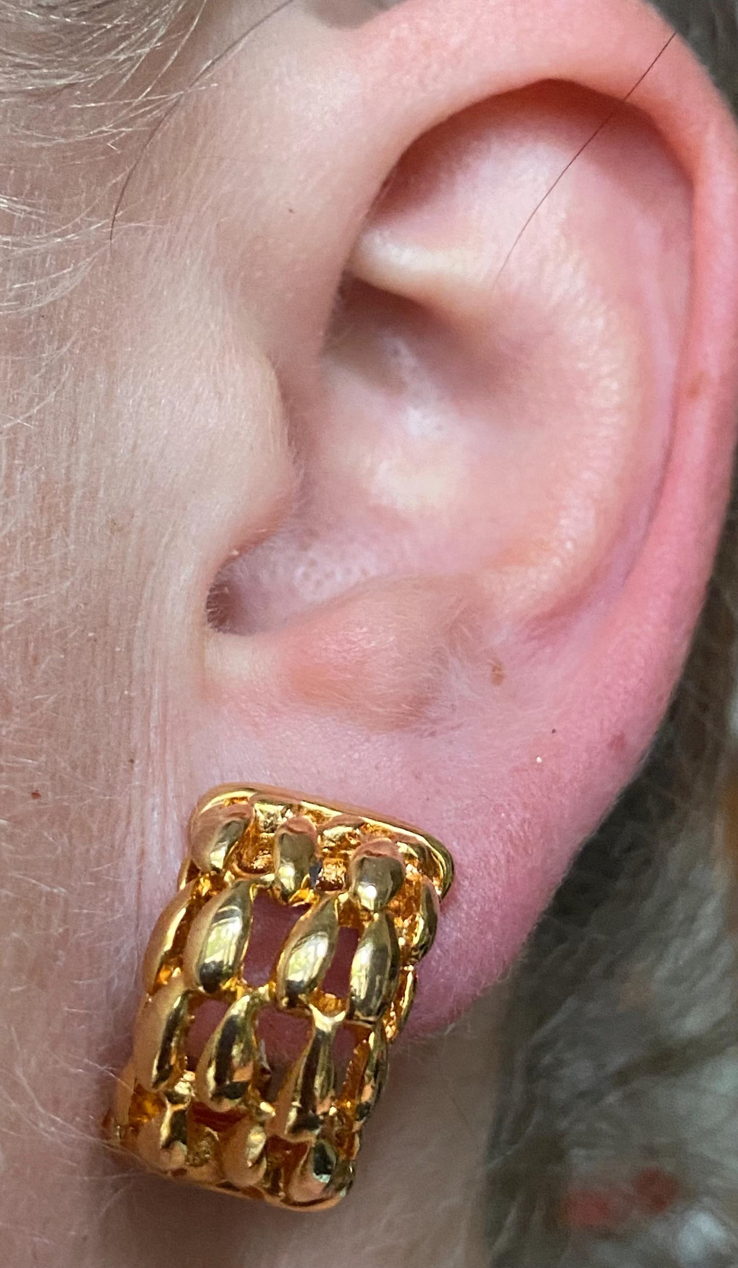 Vintage gold clip on half hoop earrings with a woven texture