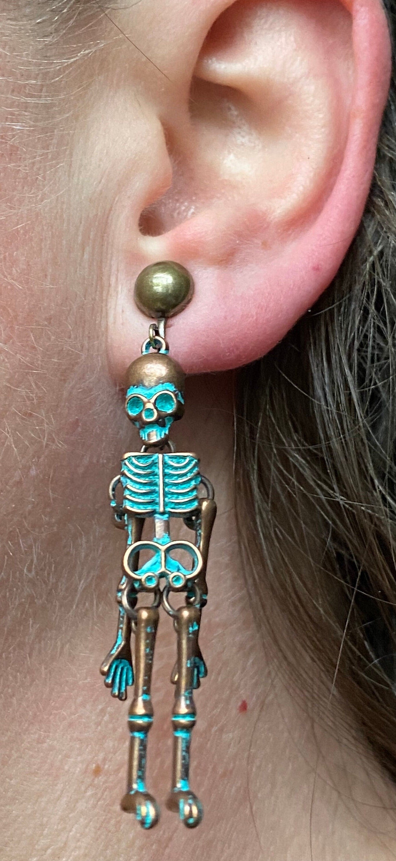 Bronze clip on skeleton earrings, dangling skellies with hinged screwback closures