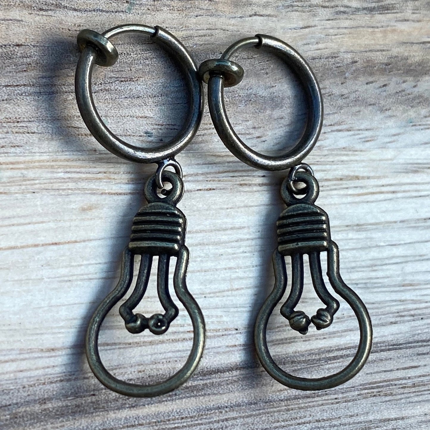 Adorable dangling lightbulb clip on earrings, cute bronze or silver earrings