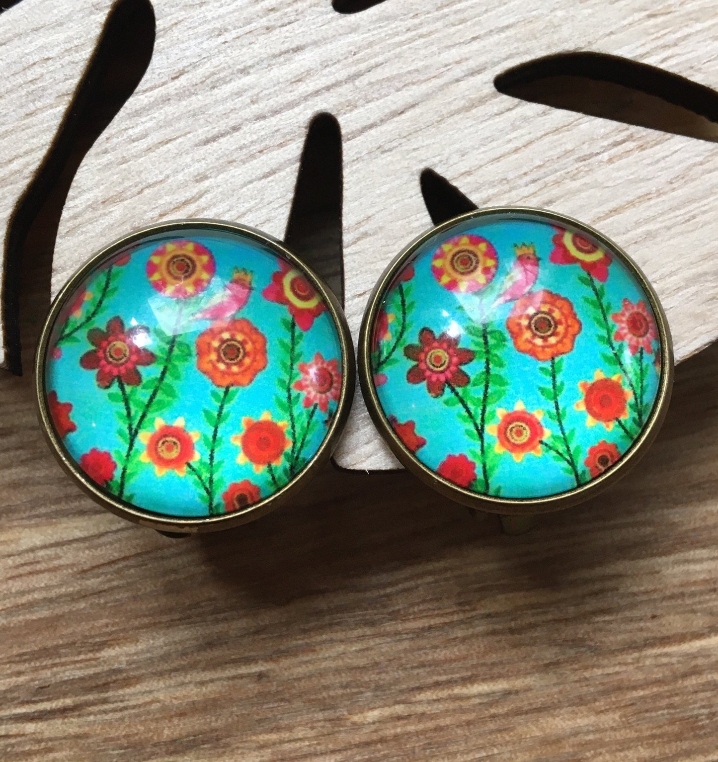 Gorgeous 20mm glass cabochon clip on earrings in a bronze coloured setting (red polka dots, flowers, trees)