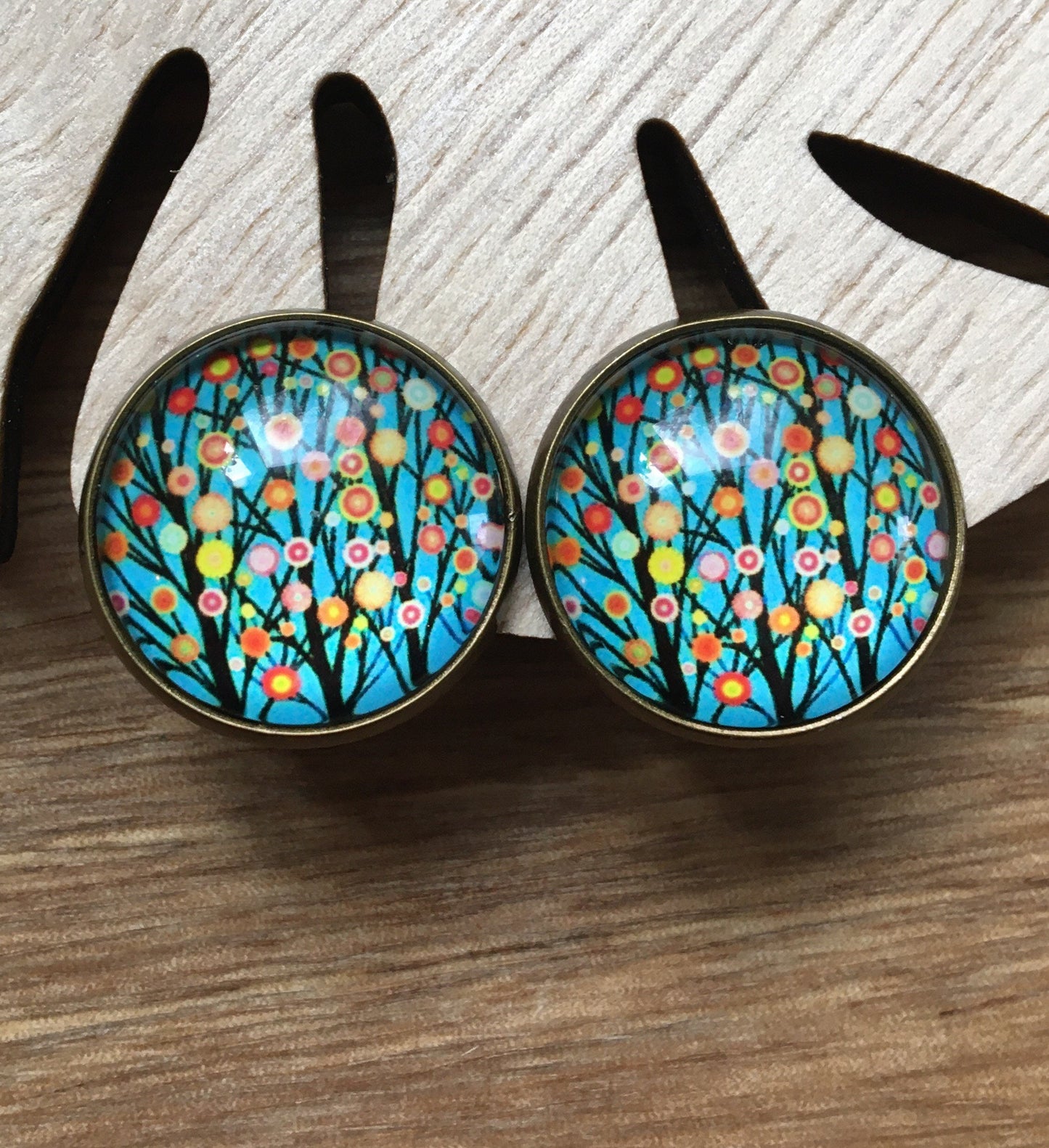 Gorgeous 20mm glass cabochon clip on earrings in a bronze coloured setting (red polka dots, flowers, trees)