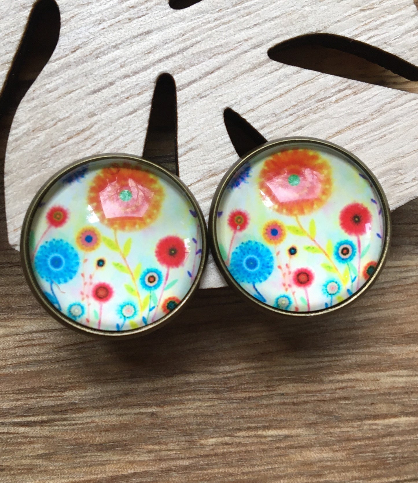 Gorgeous 20mm glass cabochon clip on earrings in a bronze coloured setting (red polka dots, flowers, trees)