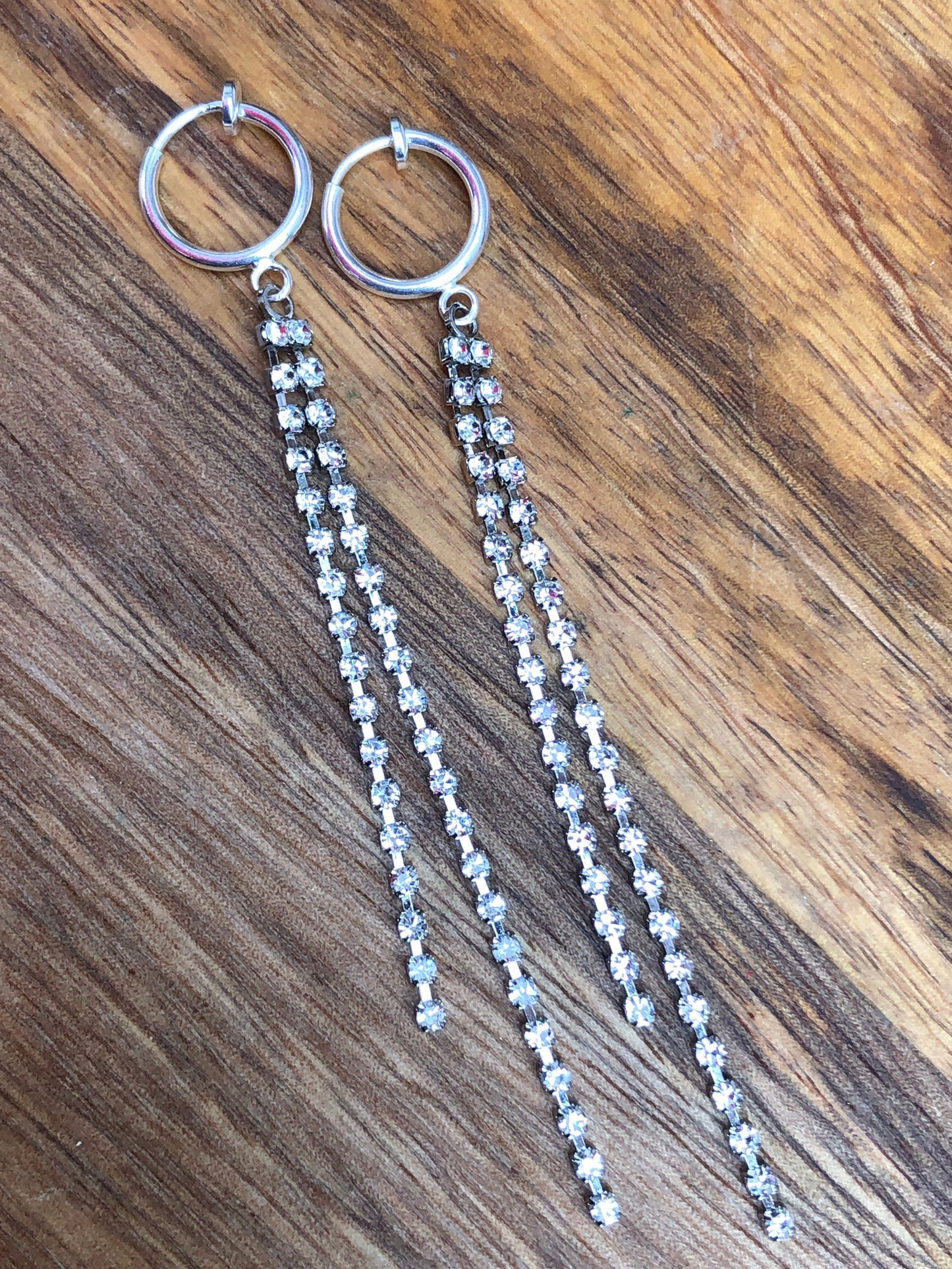 Adorable lightweight dangling rhinestone chains on clip on spring hoop earrings