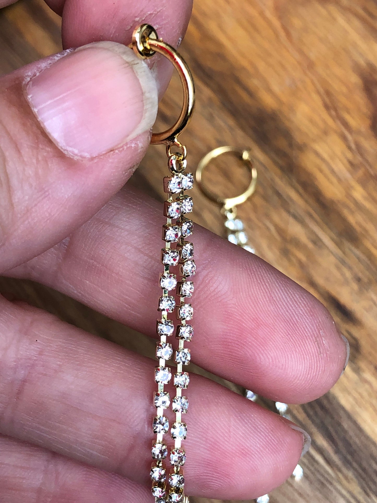 Adorable lightweight dangling rhinestone chains on clip on spring hoop earrings