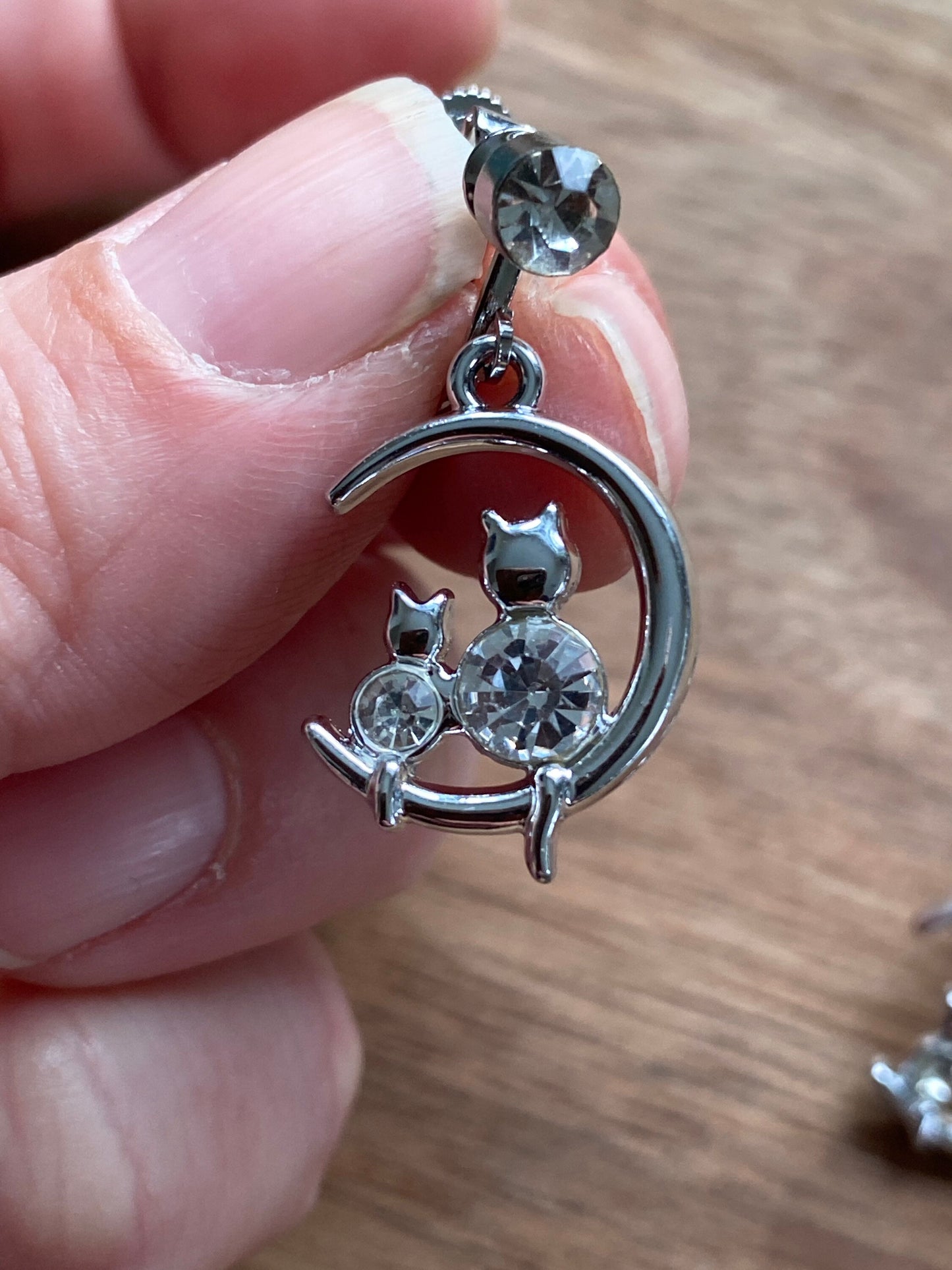 Dangling silver rhinestone moon and kitten clip on earrings (no piercing | screwback)