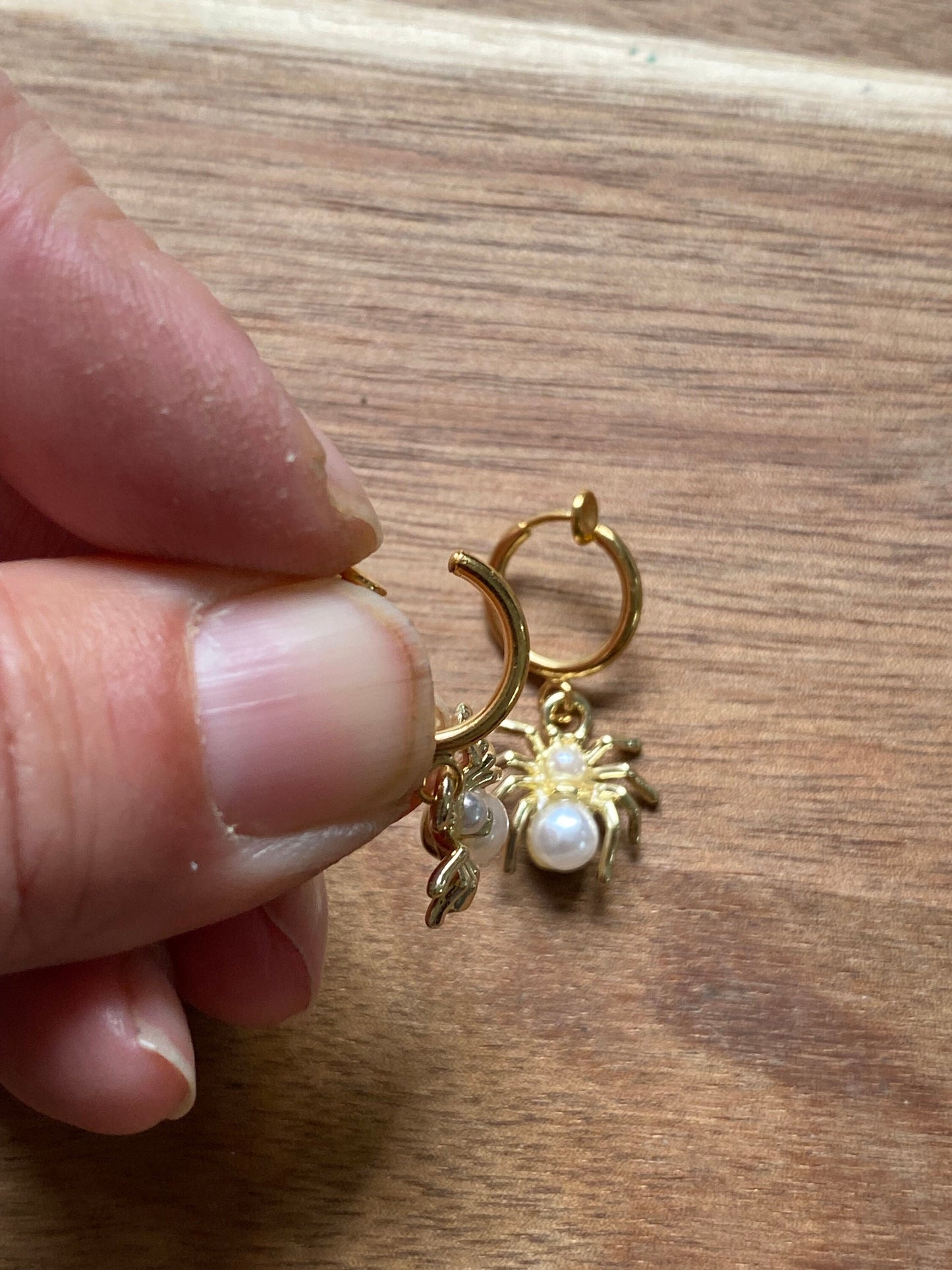 Gold and pearl dangling clip on spider earrings, faux pearl spring hoop spider earrings for unpierced ears