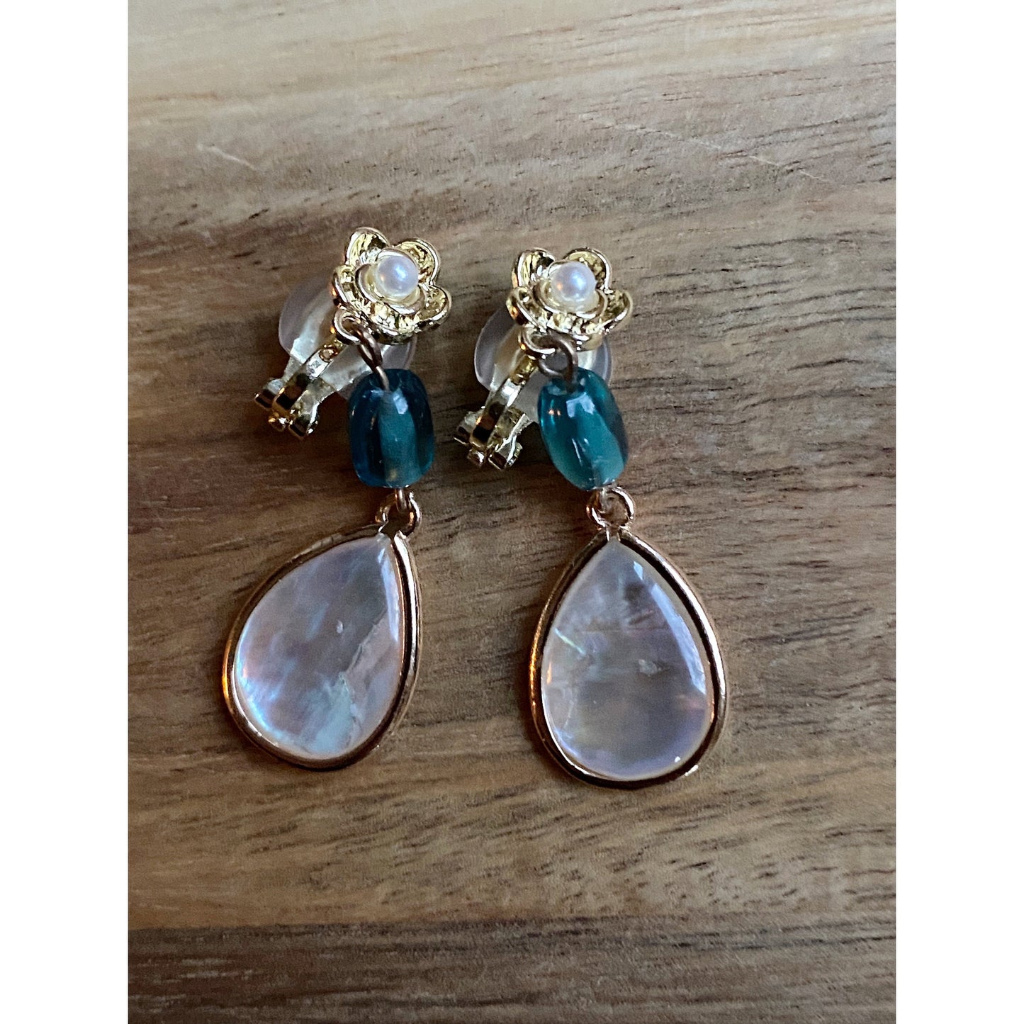 Gorgeous dangling shell teardrop clip on earrings, blue glass bead and shell earrings