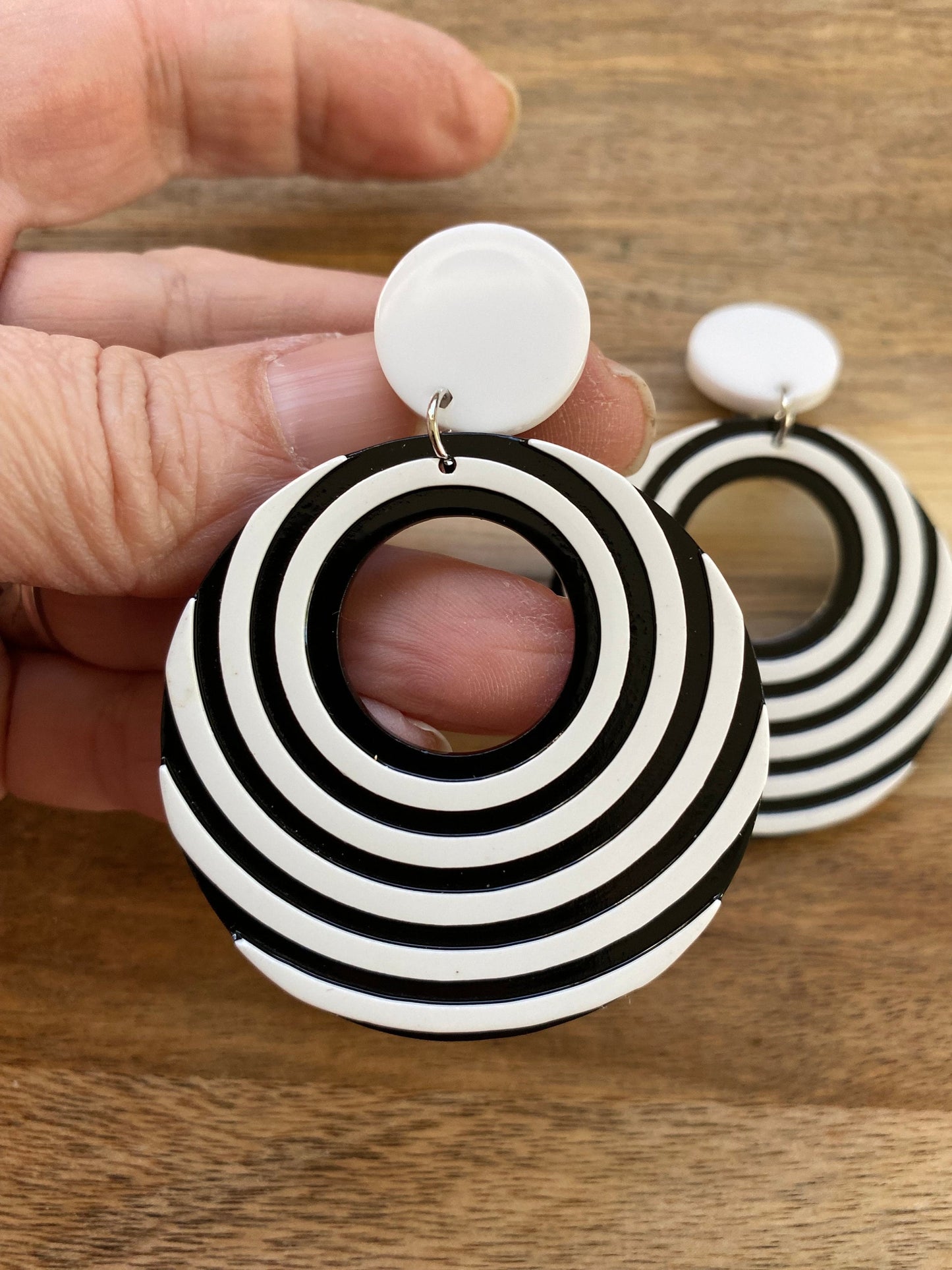 Gorgeous clip on dangling black and white plastic hoop earrings, striped hoops