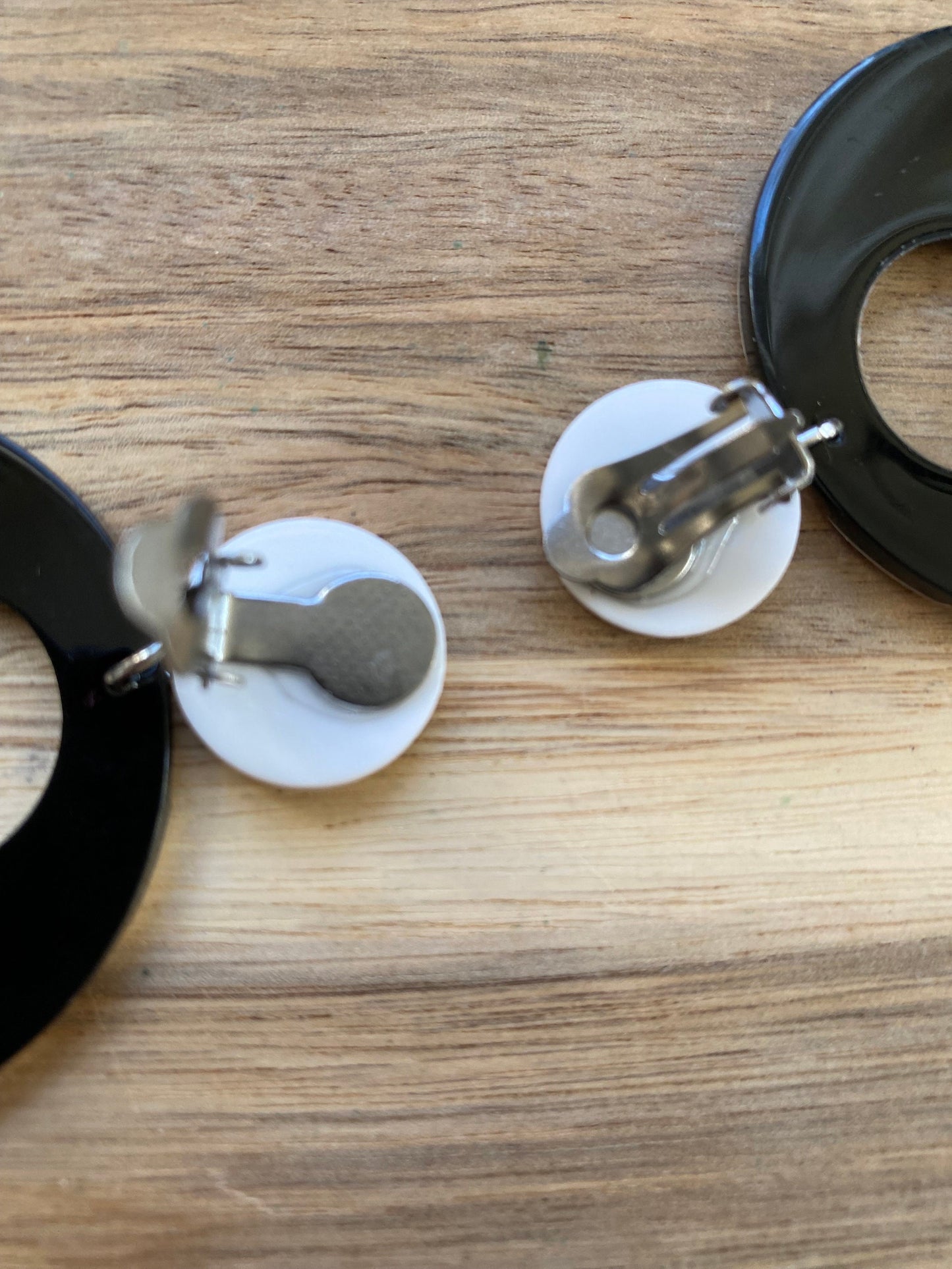 Gorgeous clip on dangling black and white plastic hoop earrings, striped hoops
