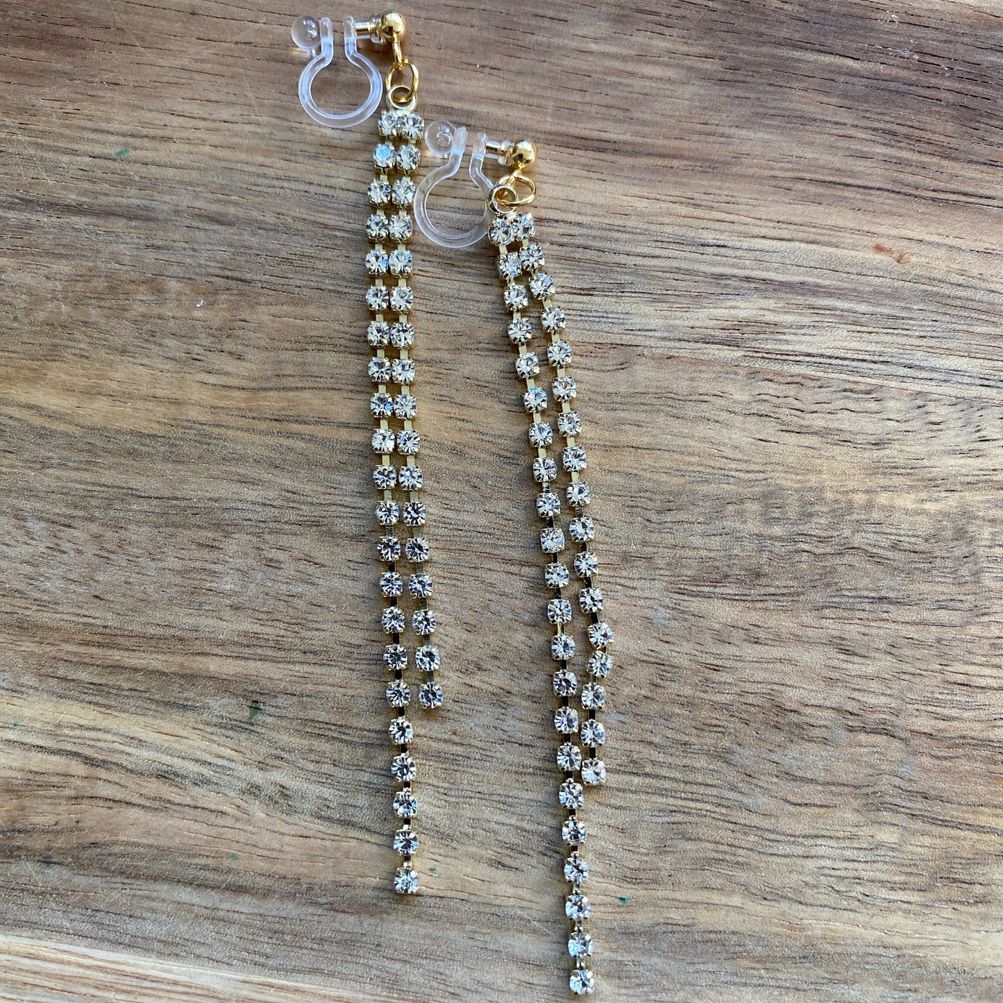 Adorable lightweight dangling rhinestone chains on clip on spring hoop earrings