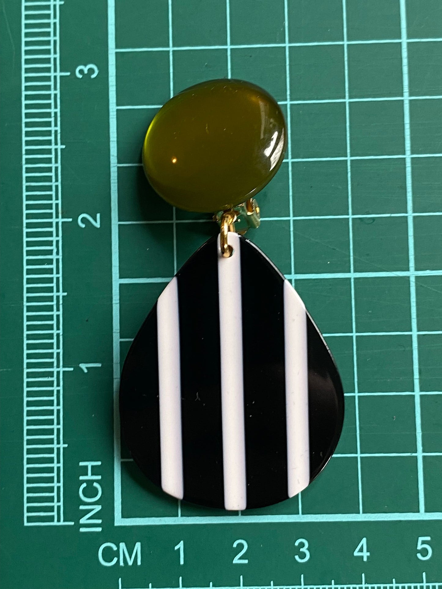 Oversized clip on green, black and white earrings