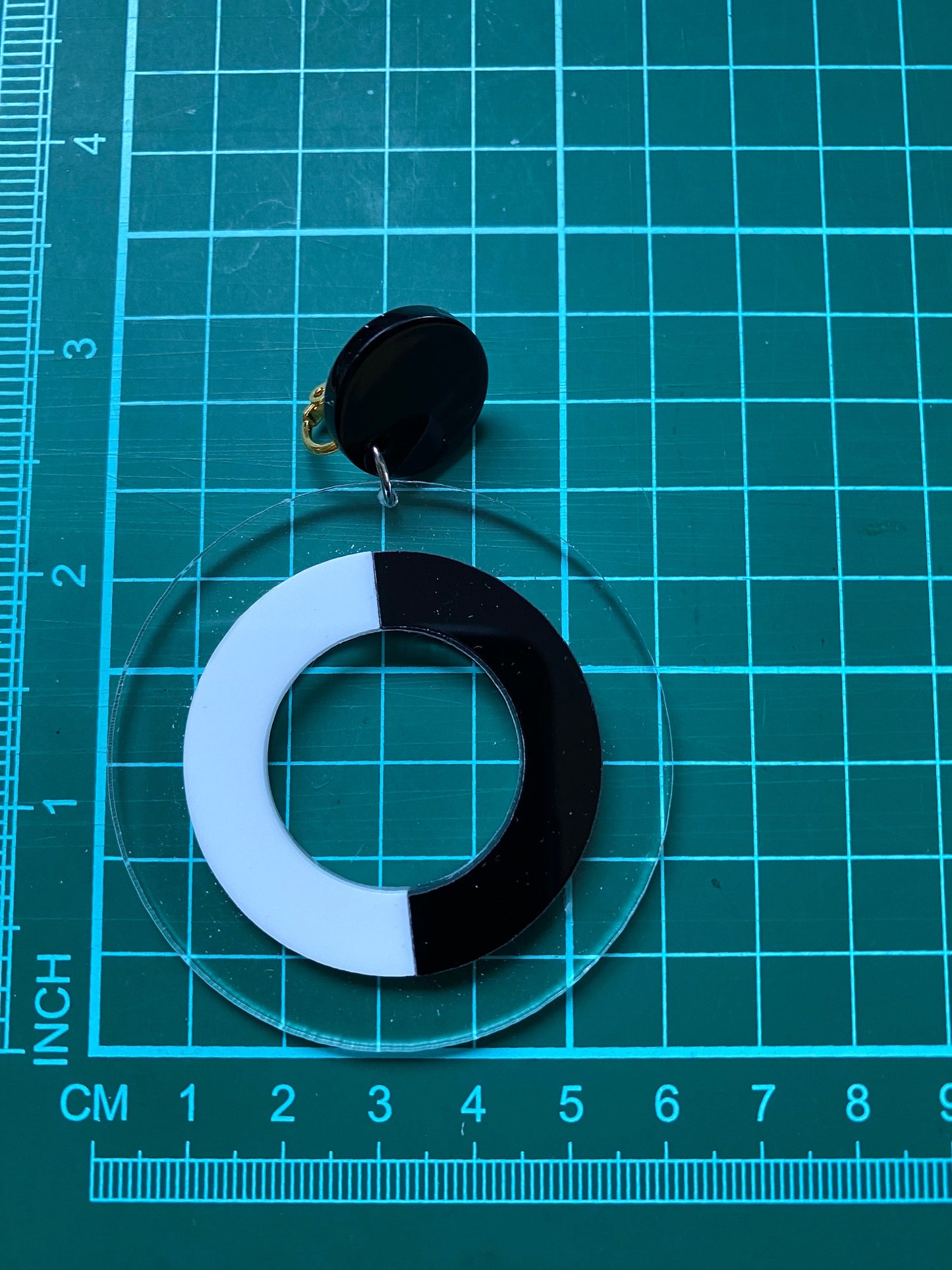 Oversized clip on black and white plastic hoop earrings