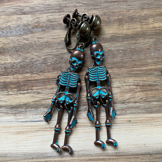 Bronze clip on skeleton earrings, dangling skellies with hinged screwback closures