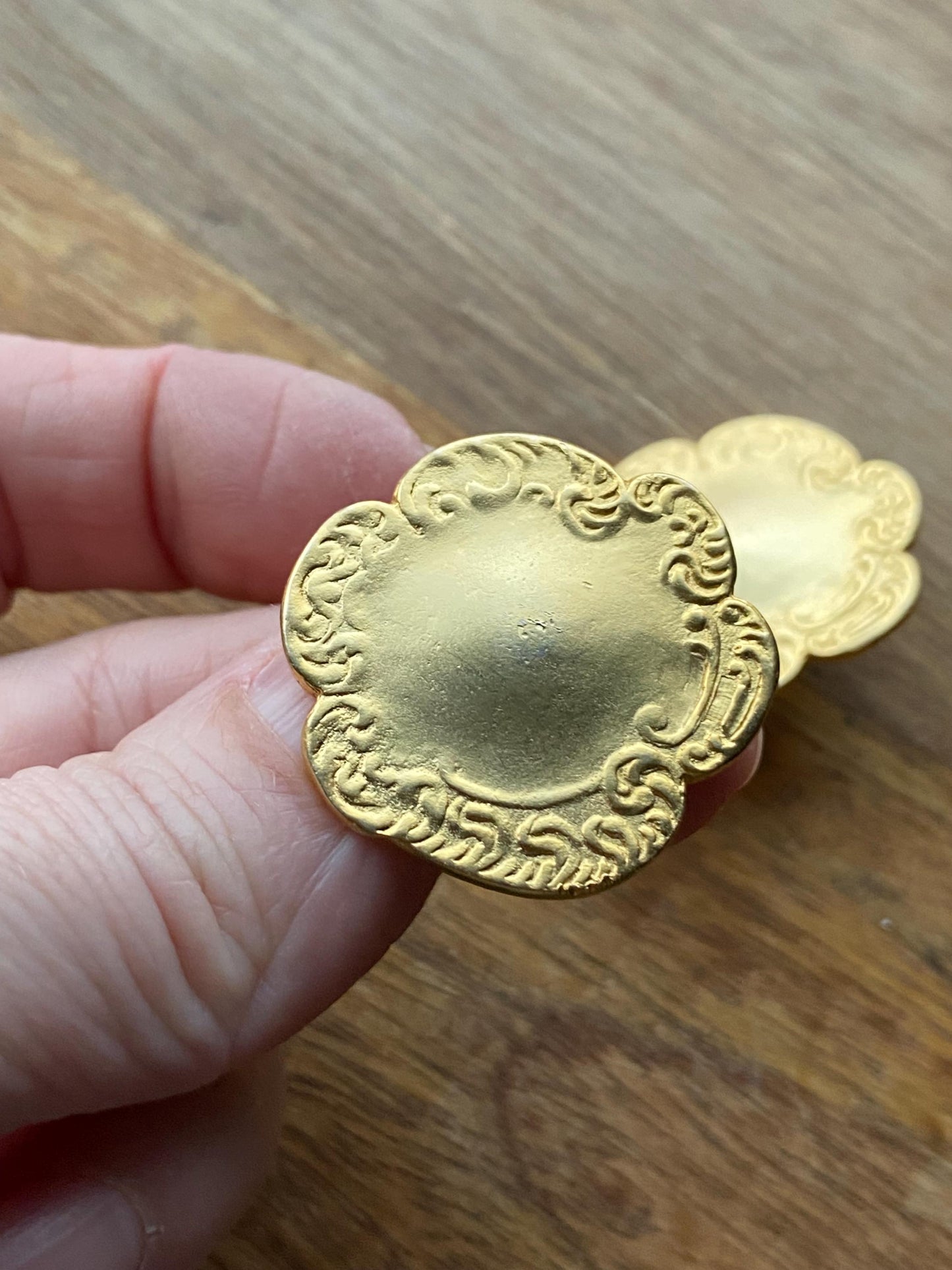 Vintage clip on matte gold button earrings with raised pattern