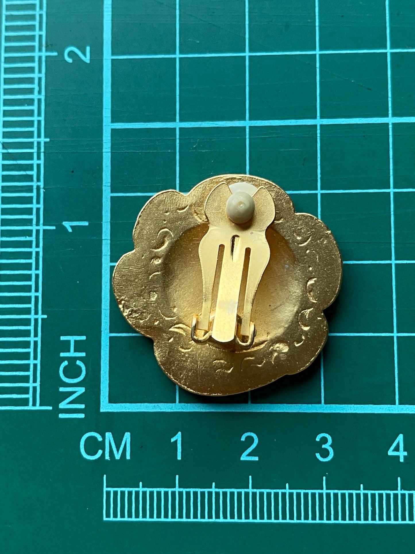 Vintage clip on matte gold button earrings with raised pattern