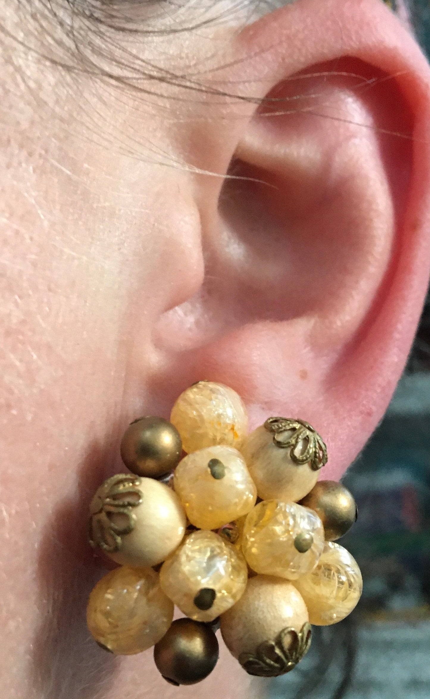 Vintage cream coloured cluster beaded clip on earrings with bronze details.