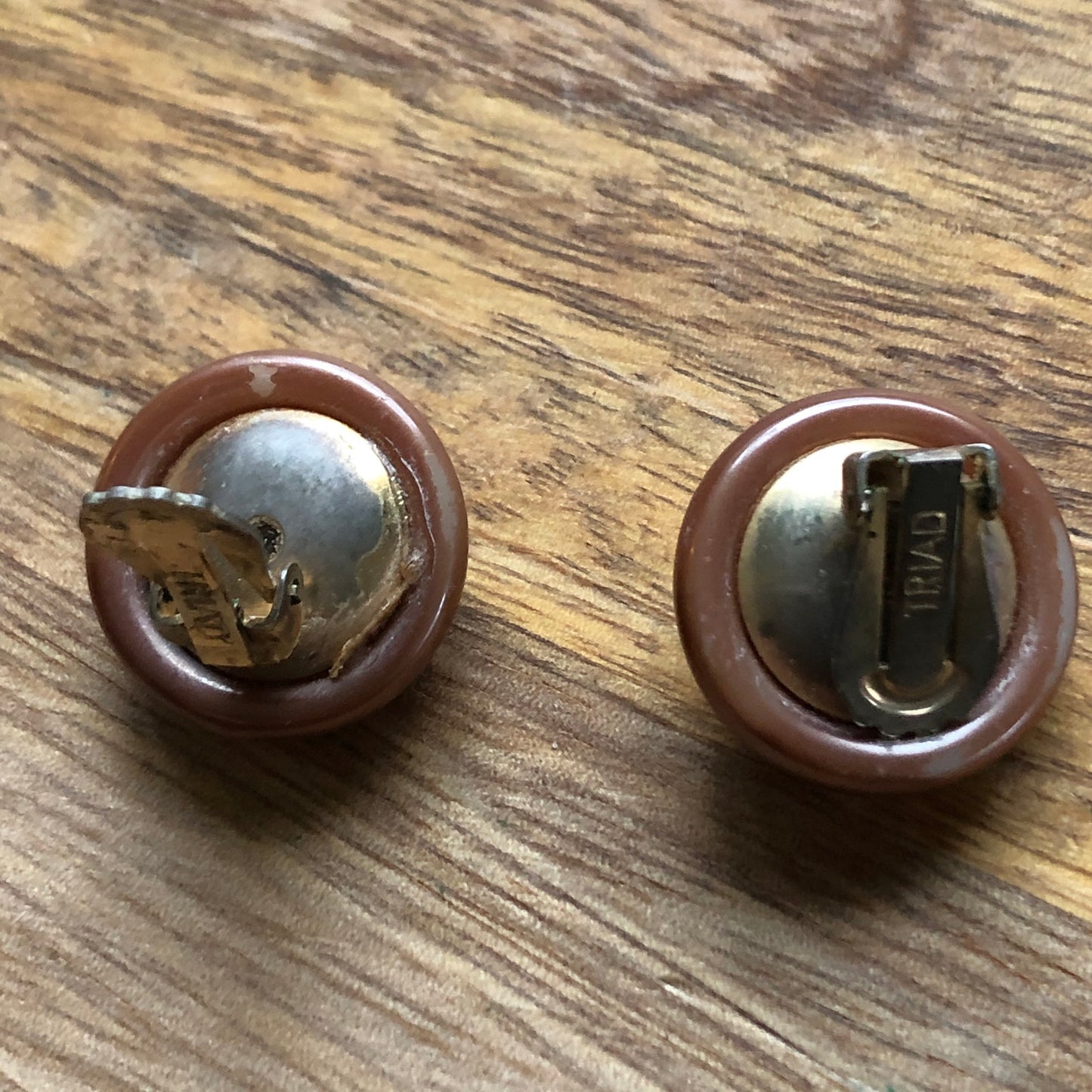 Signed triad vintage brown button clip on earrings with amber rhinestone accents