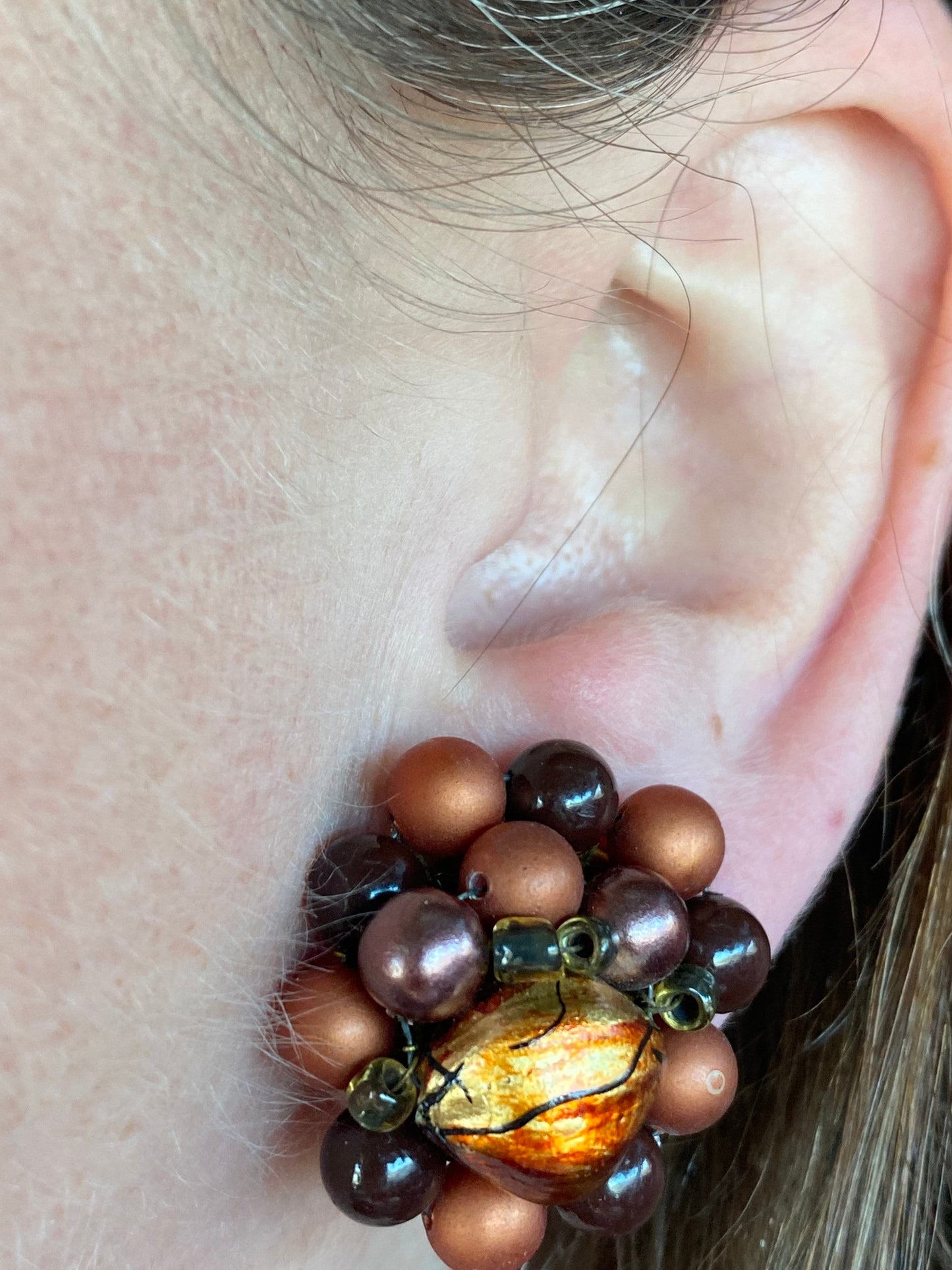 Vintage iridescent brown and orange cluster beaded clip on earrings.