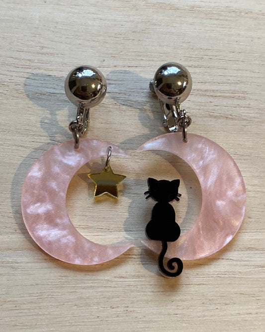 Black cat on a pink crescent moon clip on earrings